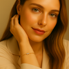 Model wearing Celeste Minimal Gold Bracelet, minimal gold chain with twin zircon centerpiece by Gwellery.