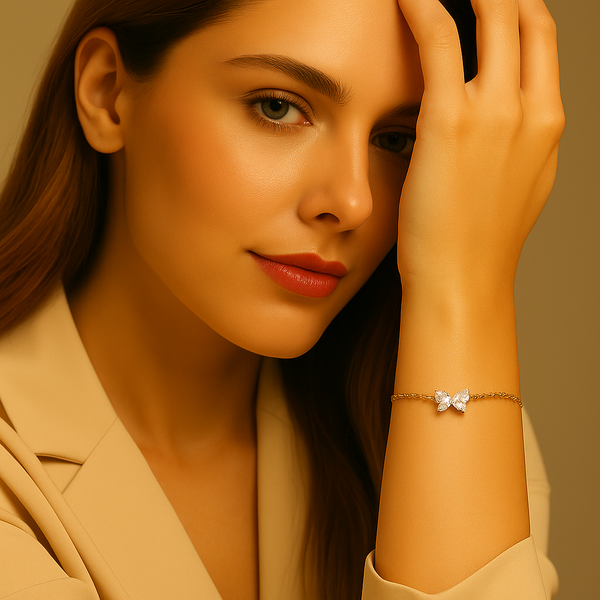 Elegant woman showcasing Celeste Minimal Gold Bracelet, fine gold-toned chain and twin crystals.